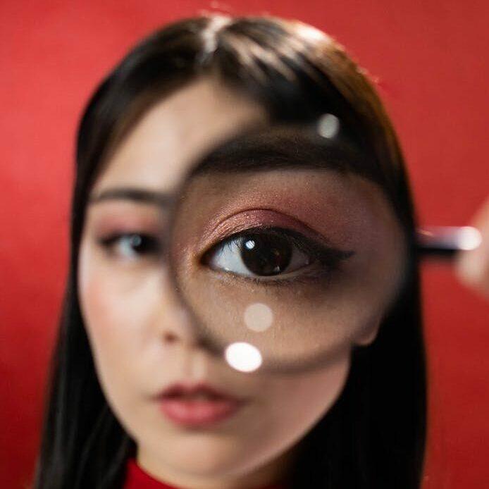 woman holding a magnifying glass